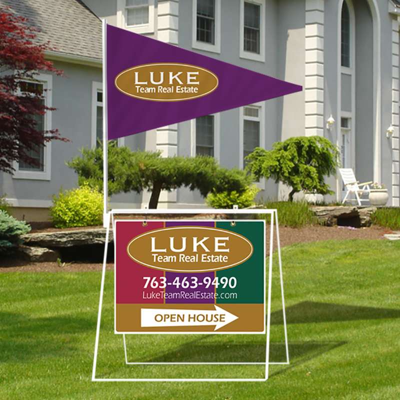 Colorful directional real estate sign