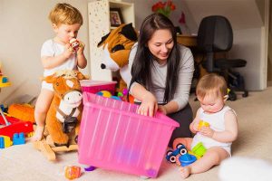 Nanny playing with two kids