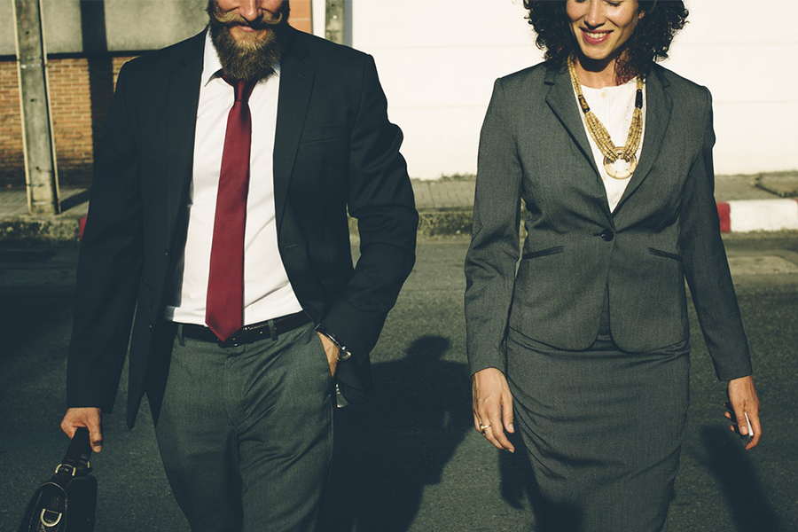 Man and woman business attire.
