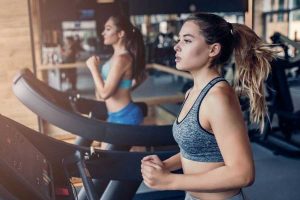 women doing exercise at gym
