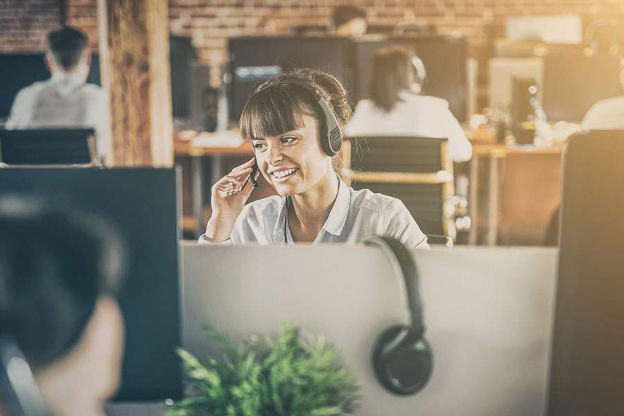 woman agent wearing a headset. answering a call