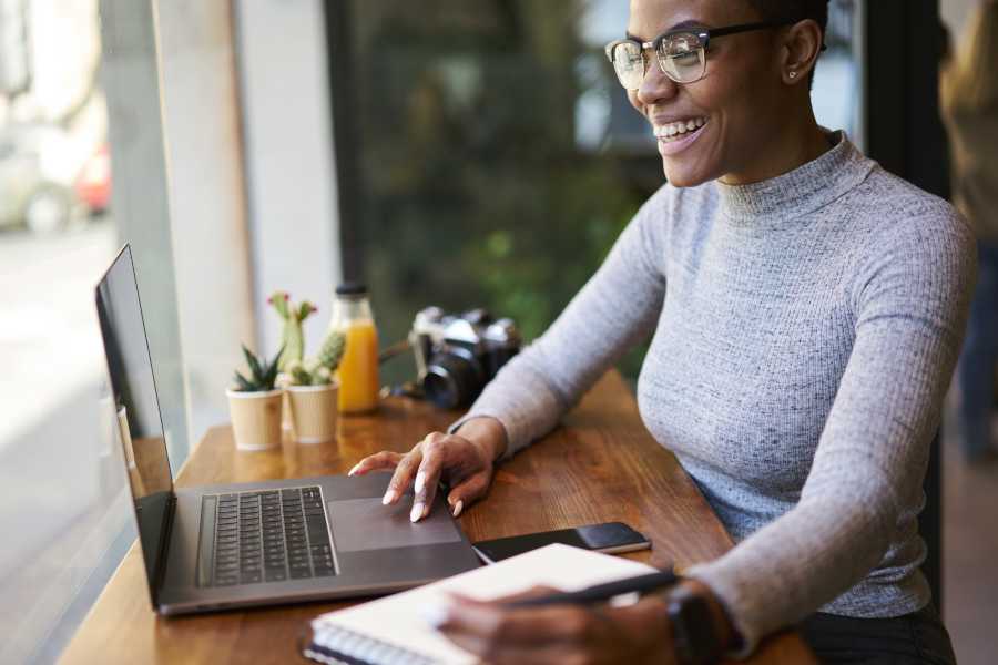 Woman working and taking notes.