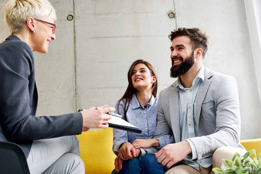 couple talking to a real estate agent