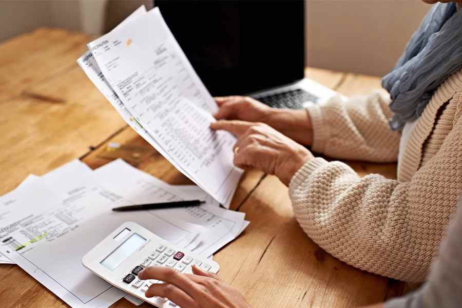 People checking on payroll forms.