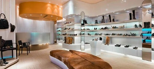Showing a shoe store using lighting to keep the space lit.