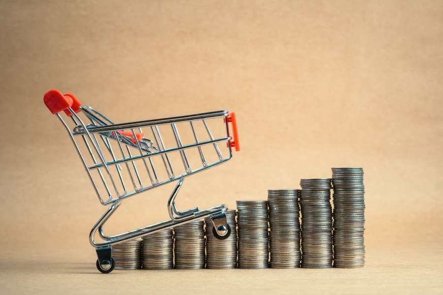 Mini shopping cart with coins.