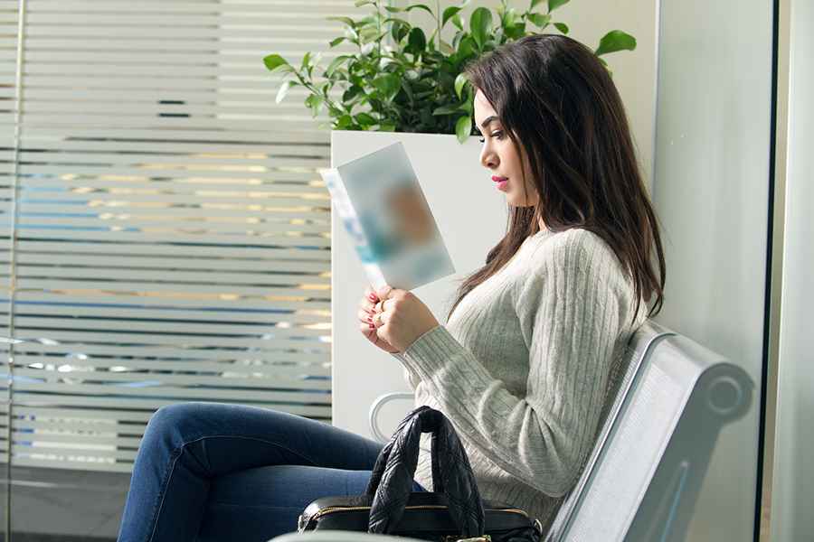 Woman reading a brochure.