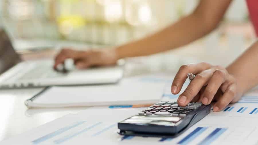 Woman using a calculator to compute.