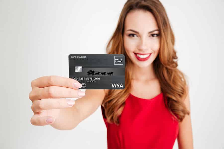 Young Woman holding a business credit card.