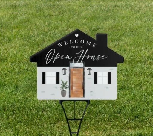 A house-shaped sign saying 