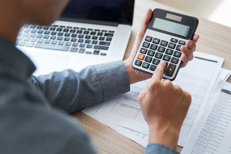 An employee using a calculator.