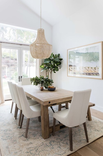 A simple staged dining room with natural light.