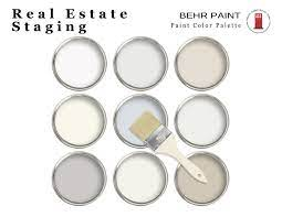 Paint cans with neutral color paints from Behr for real estate home staging.