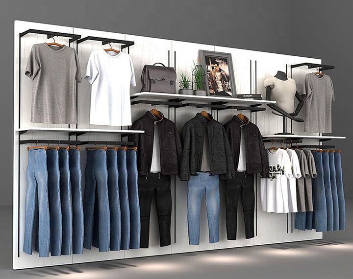 Mens clothing store wall display with jeans and t-shirts.