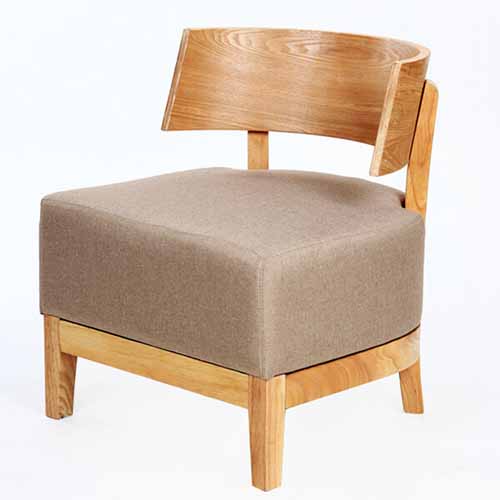 Wooden armchair with beige suede seat.