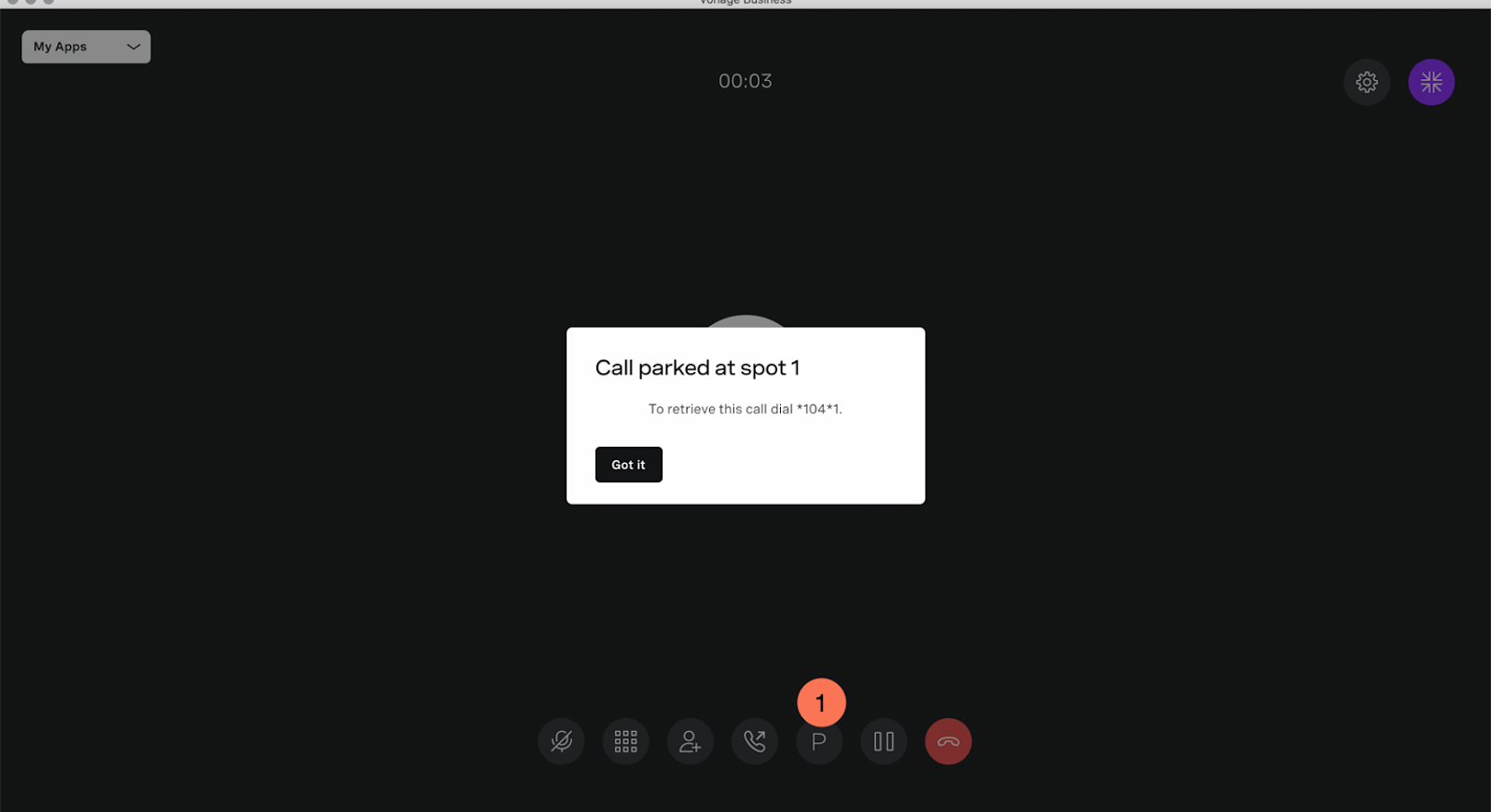 Vonage desktop interface showing a live call and a dialog box notifying the user that the call is parked at spot 1.