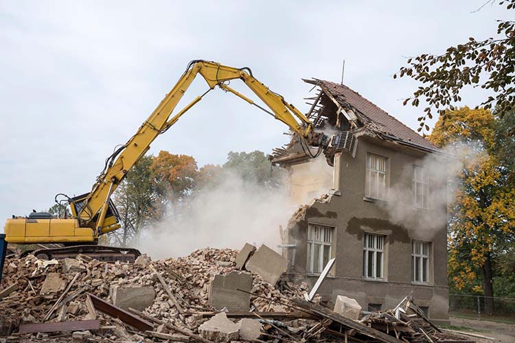 Bulldozer demolition of a house